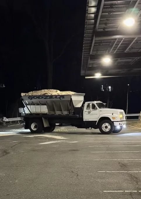 Godzilla, a Clear Landscaping salt truck loaded with de-icing material at night
