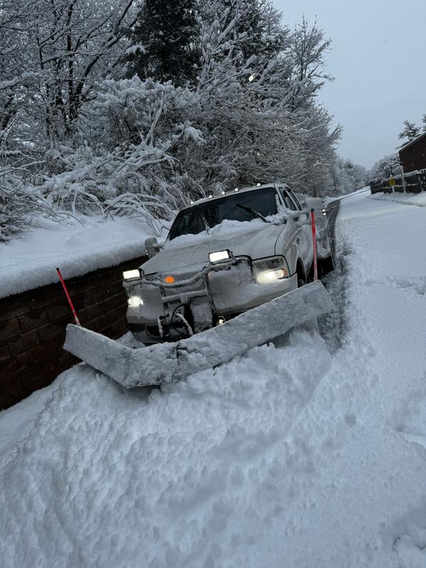 Plow truck on a cleared commercial route after a storm